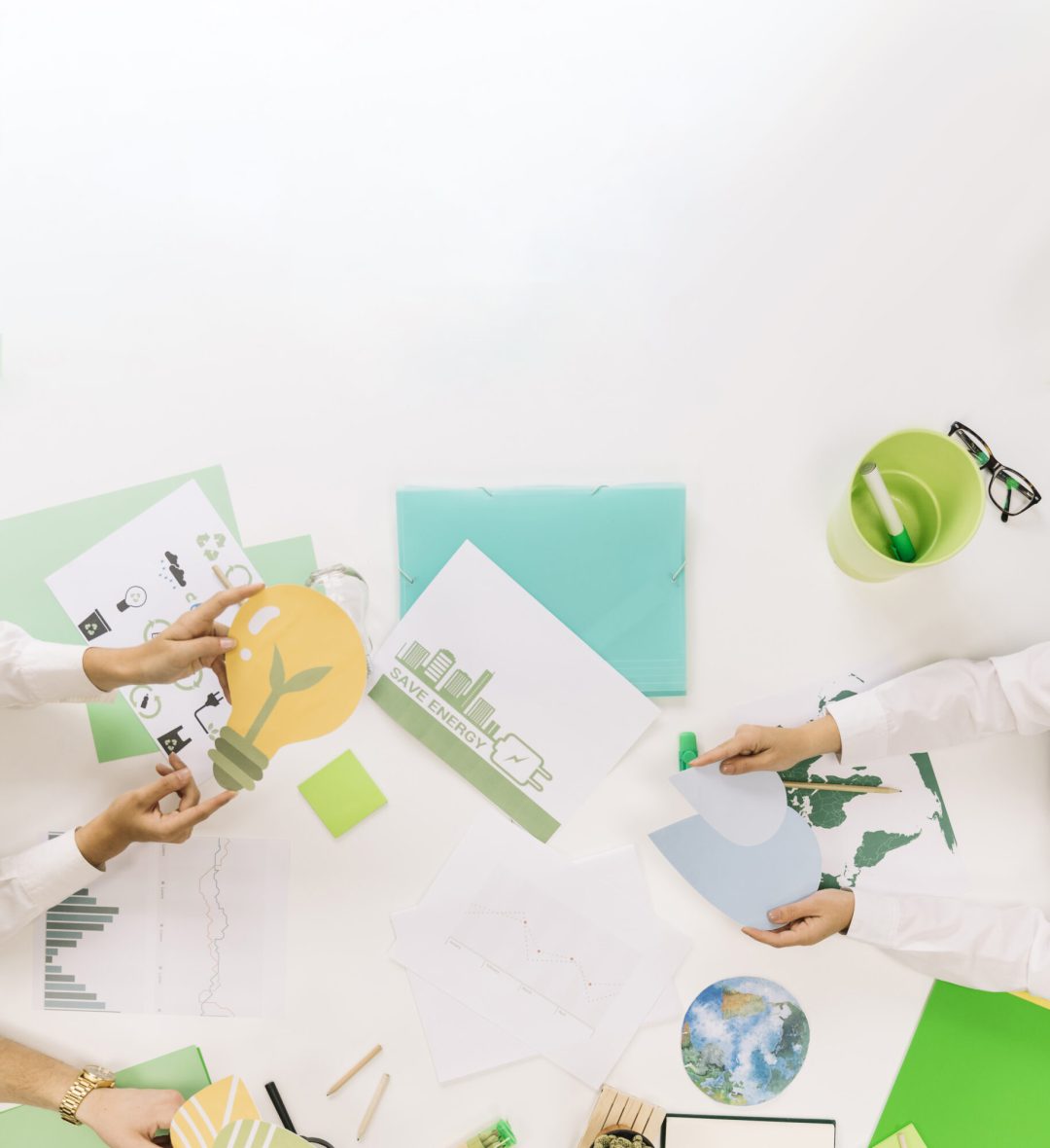 group-businesspeople-holding-energy-saving-icons-desk